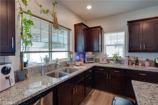 Interior, Kitchen, Recessed Lighting, Washer, Wood Texture Flooring