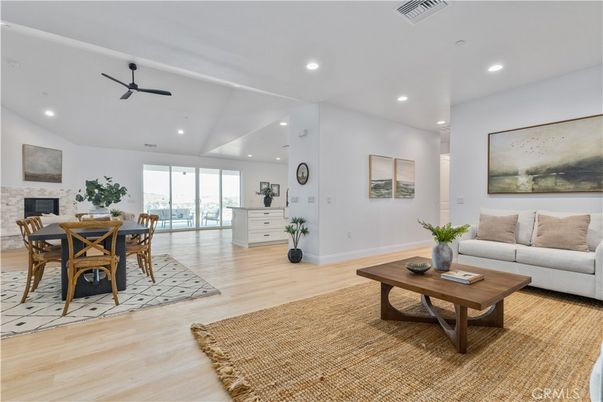 Dining room, Fireplace, Interior, Living room, Recessed Lighting, Wood Texture Flooring