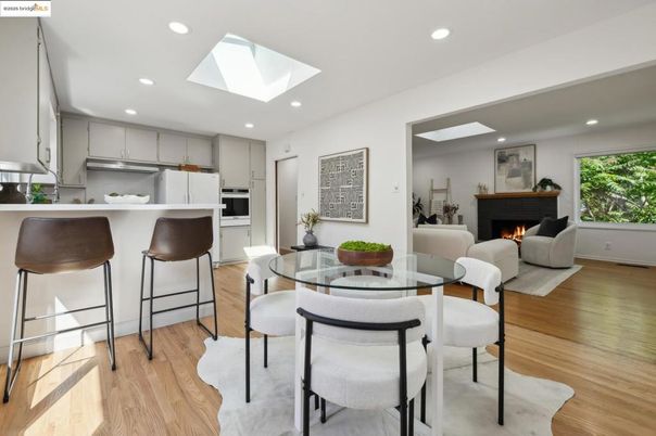 Dining room, Fireplace, Interior, Kitchen, Living room, Recessed Lighting, Stainless Steel Appliances, Wood Texture Flooring