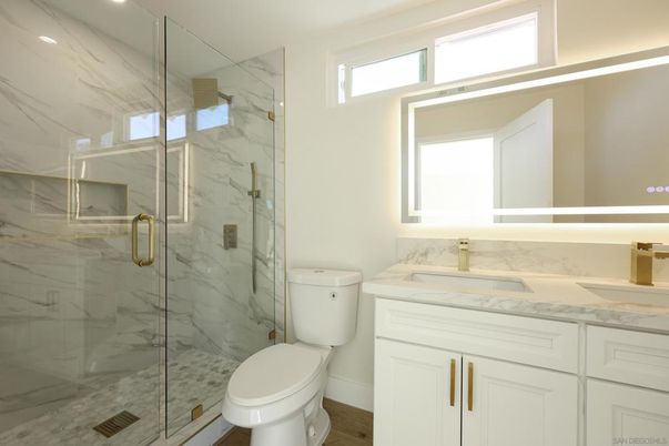 Bathroom, Glass Shower, Interior, Marble Walls, Recessed Lighting, Wood Texture Flooring