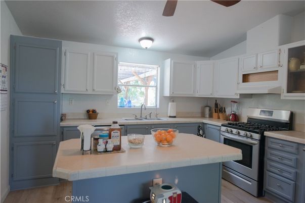 Interior, Kitchen, Stainless Steel Appliances, Tile Countertops, Wood Texture Flooring