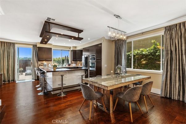 Chandelier, Dining room, Interior, Kitchen, Pendant Lights, Recessed Lighting, Stainless Steel Appliances, Wood Texture Flooring