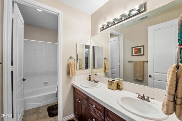 Bathroom, Dual Sink Vanities, Interior, Recessed Lighting, Tile Countertops