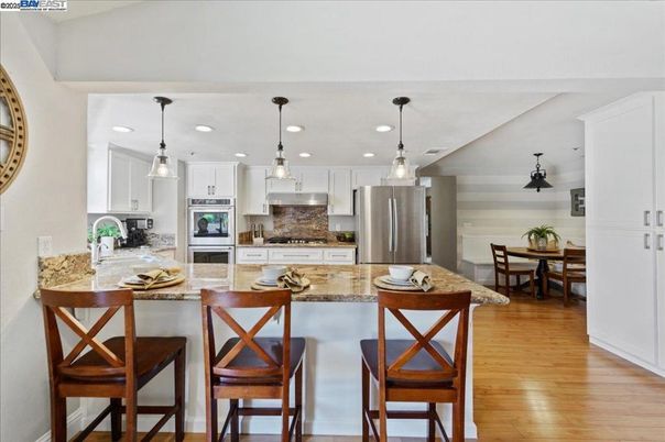 Dining room, Interior, Kitchen, Pendant Lights, Recessed Lighting, Stainless Steel Appliances, Wood Texture Flooring