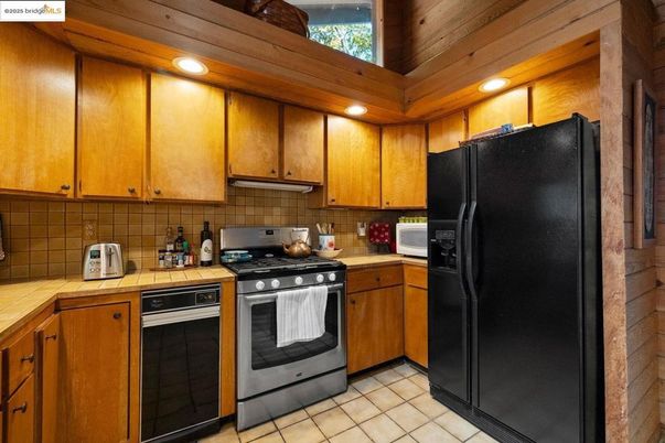 Interior, Kitchen, Recessed Lighting, Tile Countertops, Wooden Ceilings