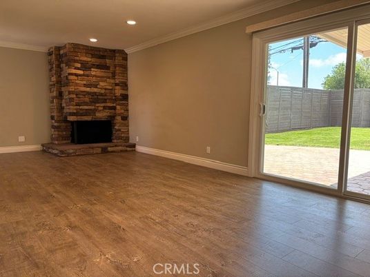 Empty room, Fireplace, Interior, Recessed Lighting, Stone Walls, Wood Texture Flooring