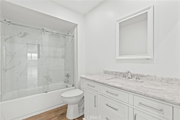 Bathroom, Glass Shower, Interior, Marble Walls, Wood Texture Flooring