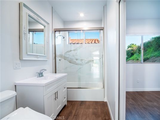 Bathroom, Glass Shower, Interior, Marble Walls, Recessed Lighting, Wood Texture Flooring