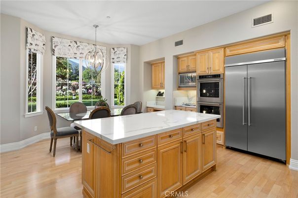 Chandelier, Dining room, Interior, Kitchen, Pendant Lights, Stainless Steel Appliances, Wood Texture Flooring