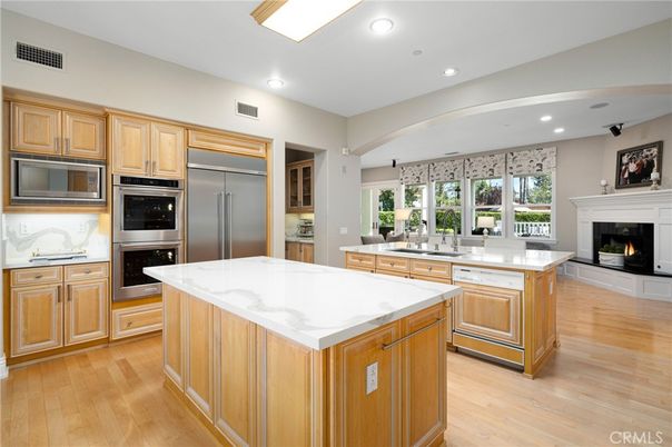 Fireplace, Interior, Kitchen, Recessed Lighting, Stainless Steel Appliances, Wood Texture Flooring