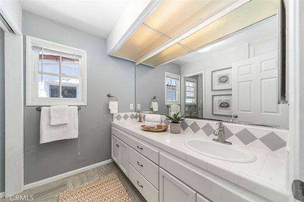 Bathroom, Dual Sink Vanities, Interior, Tile Countertops, Wood Texture Flooring