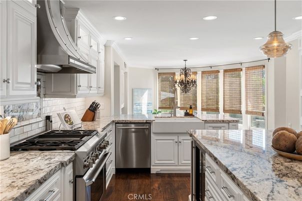 Chandelier, Interior, Kitchen, Pendant Lights, Recessed Lighting, Stainless Steel Appliances, Wood Texture Flooring