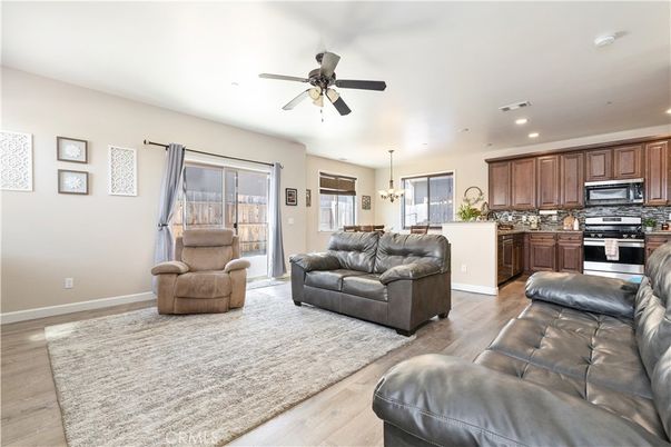 Chandelier, Interior, Kitchen, Living room, Pendant Lights, Recessed Lighting, Stainless Steel Appliances, Wood Texture Flooring