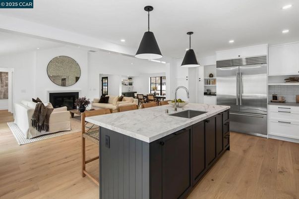 Dining room, Fireplace, Interior, Kitchen, Living room, Pendant Lights, Recessed Lighting, Stainless Steel Appliances, Wood Texture Flooring