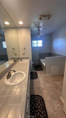 Bathroom, Dual Sink Vanities, Interior, Recessed Lighting, Tile Countertops