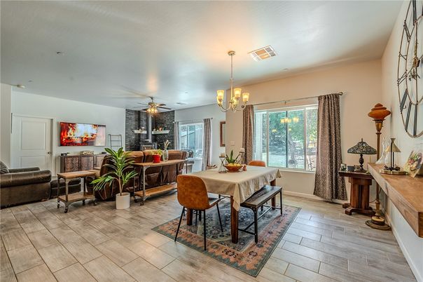 Chandelier, Dining room, Fireplace, Interior, Living room, Stone Walls, Wood Texture Flooring