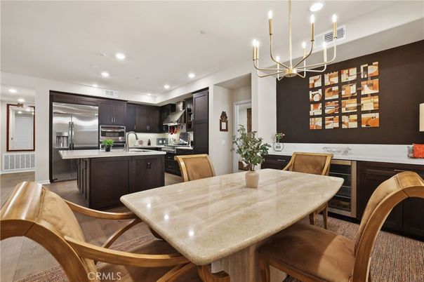 Chandelier, Dining room, Interior, Kitchen, Recessed Lighting, Stainless Steel Appliances, Wood Texture Flooring