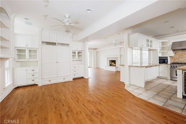 Empty room, Fireplace, Interior, Kitchen, Recessed Lighting, Wood Texture Flooring