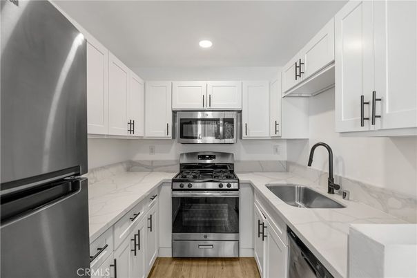 Interior, Kitchen, Recessed Lighting, Stainless Steel Appliances, Wood Texture Flooring
