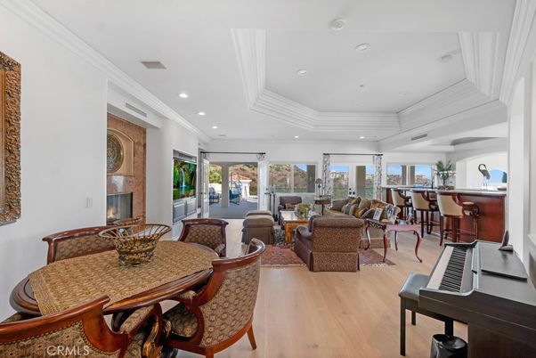 Dining room, Fireplace, Interior, Living room, Piano, Recessed Lighting, Wood Texture Flooring