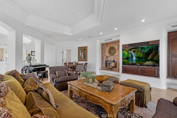 Dining room, Fireplace, Interior, Living room, Piano, Recessed Lighting, Wood Texture Flooring
