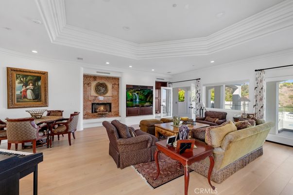 Dining room, Fireplace, Interior, Living room, Recessed Lighting, Wood Texture Flooring