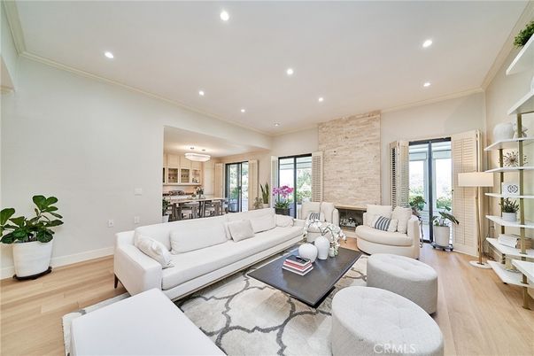 Dining room, Fireplace, Interior, Living room, Recessed Lighting, Stone Walls, Wood Texture Flooring