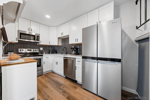 Interior, Kitchen, Recessed Lighting, Stainless Steel Appliances, Wood Texture Flooring