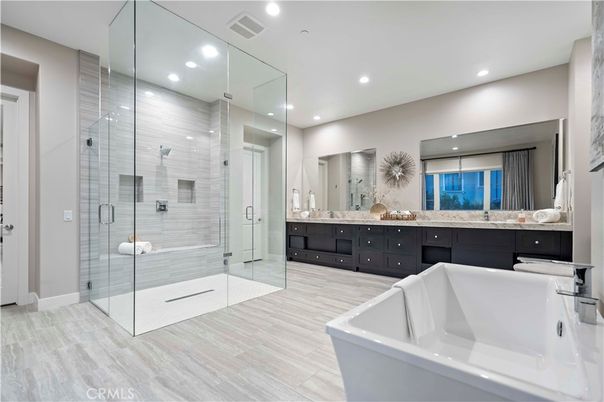 Bathroom, Dual Sink Vanities, Free Standing Baths, Glass Shower, Interior, Recessed Lighting, Wood Texture Flooring