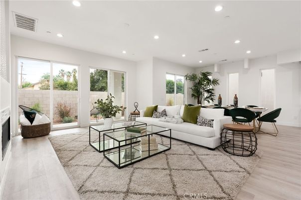 Dining room, Fireplace, Interior, Living room, Recessed Lighting, Wood Texture Flooring