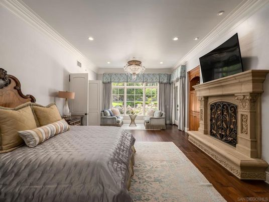 Bedroom, Chandelier, Fireplace, Interior, Recessed Lighting, Wood Texture Flooring