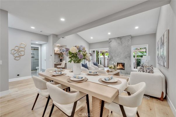 Dining room, Fireplace, Interior, Living room, Marble Walls, Recessed Lighting, Wood Texture Flooring