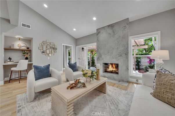 Fireplace, Interior, Living room, Marble Walls, Recessed Lighting, Wood Texture Flooring