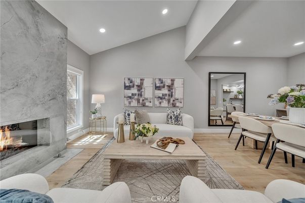 Dining room, Fireplace, Interior, Living room, Recessed Lighting, Wood Texture Flooring