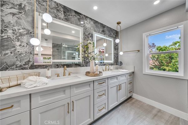 Bathroom, Dual Sink Vanities, Interior, Marble, Marble Walls, Pendant Lights, Recessed Lighting