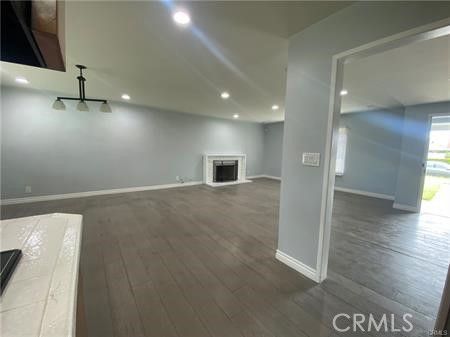 Empty room, Fireplace, Interior, Pendant Lights, Recessed Lighting, Wood Texture Flooring