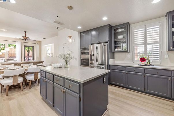 Dining room, Interior, Kitchen, Pendant Lights, Recessed Lighting, Stainless Steel Appliances, Wood Texture Flooring