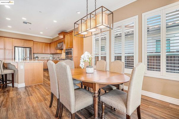 Dining room, Interior, Kitchen, Pendant Lights, Recessed Lighting, Stainless Steel Appliances, Wood Texture Flooring