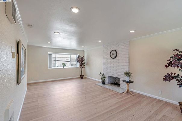 Empty room, Fireplace, Interior, Recessed Lighting, Stone Walls, Wood Texture Flooring