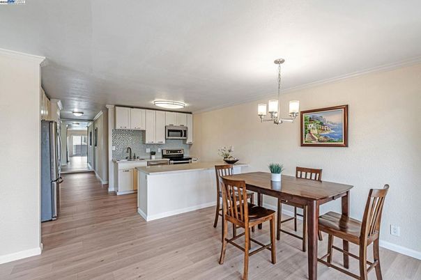 Dining room, Interior, Kitchen, Pendant Lights, Stainless Steel Appliances, Wood Texture Flooring