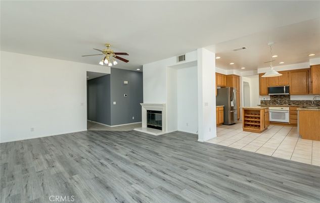 Empty room, Fireplace, Interior, Kitchen, Pendant Lights, Recessed Lighting, Wood Texture Flooring