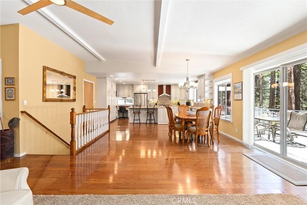 Chandelier, Dining room, Interior, Kitchen, Recessed Lighting, Stainless Steel Appliances, Wood Texture Flooring