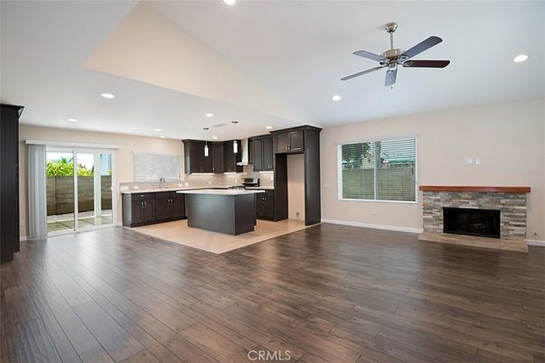Empty room, Fireplace, Interior, Kitchen, Pendant Lights, Recessed Lighting, Wood Texture Flooring