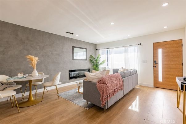 Dining room, Fireplace, Interior, Living room, Recessed Lighting, Wood Texture Flooring