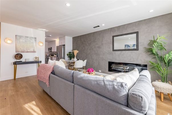 Dining room, Fireplace, Interior, Living room, Recessed Lighting, Wood Texture Flooring