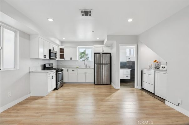 Interior, Kitchen, Recessed Lighting, Stainless Steel Appliances, Wood Texture Flooring