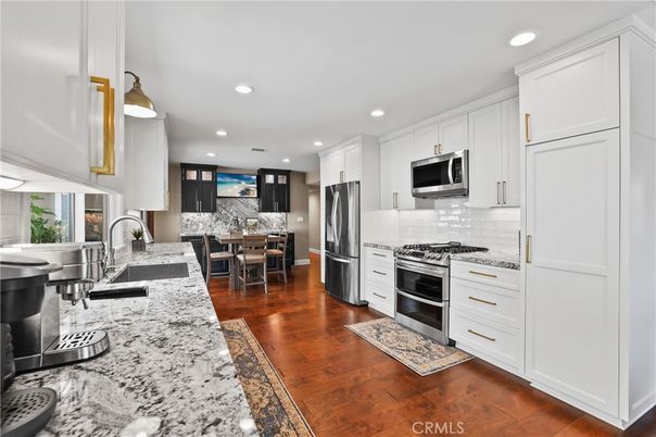Dining room, Interior, Kitchen, Recessed Lighting, Stainless Steel Appliances, Wood Texture Flooring