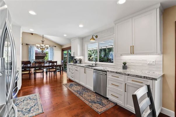 Chandelier, Dining room, Interior, Kitchen, Recessed Lighting, Stainless Steel Appliances, Wood Texture Flooring