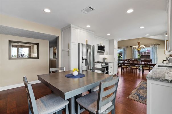 Chandelier, Dining room, Interior, Kitchen, Recessed Lighting, Stainless Steel Appliances, Wood Texture Flooring