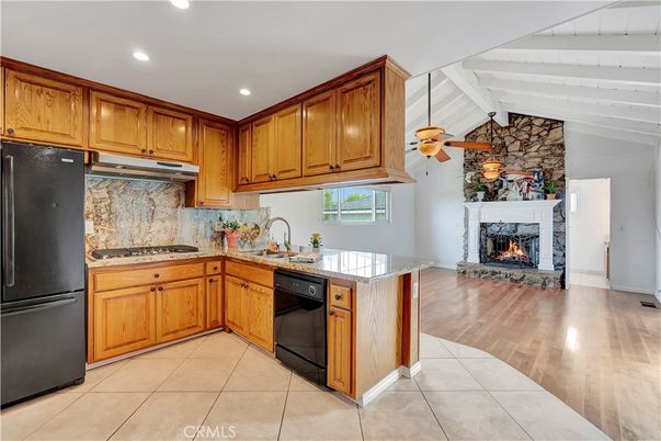 Fireplace, Interior, Kitchen, Recessed Lighting, Stone Walls, Wood Texture Flooring